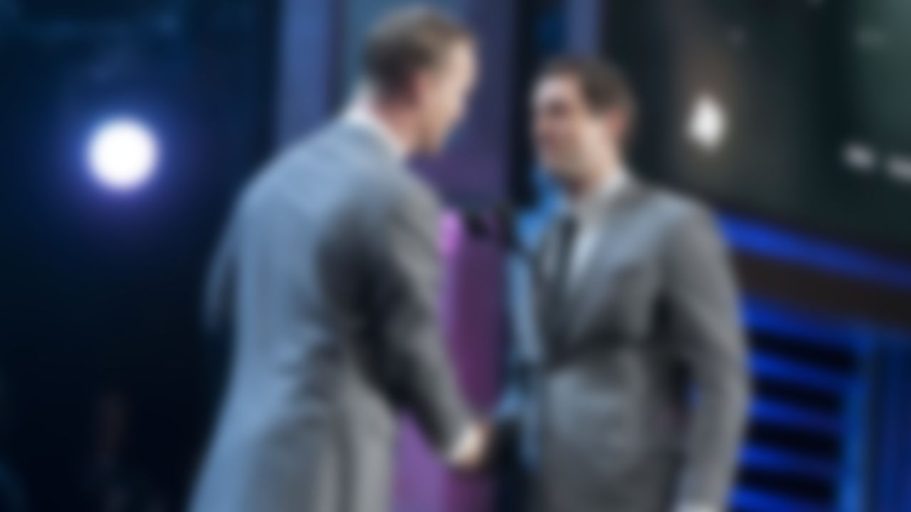 Green Bay Packers' Aaron Rodgers accepts the MVP award from Peyton Manning during the inaugural NFL Honors show Saturday, Feb. 4, 2012, in Indianapolis.