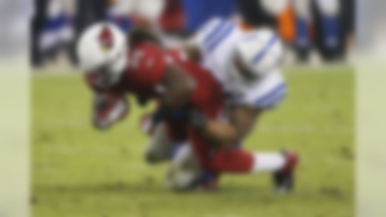 Arizona Cardinals running back Andre Ellington (38) is tackled by Indianapolis Colts inside linebacker Jerrell Freeman during the second half of an NFL football game, Sunday, Nov. 24, 2013, in Glendale, Ariz. The Cardinals won 40-11. (AP Photo/Matt York)