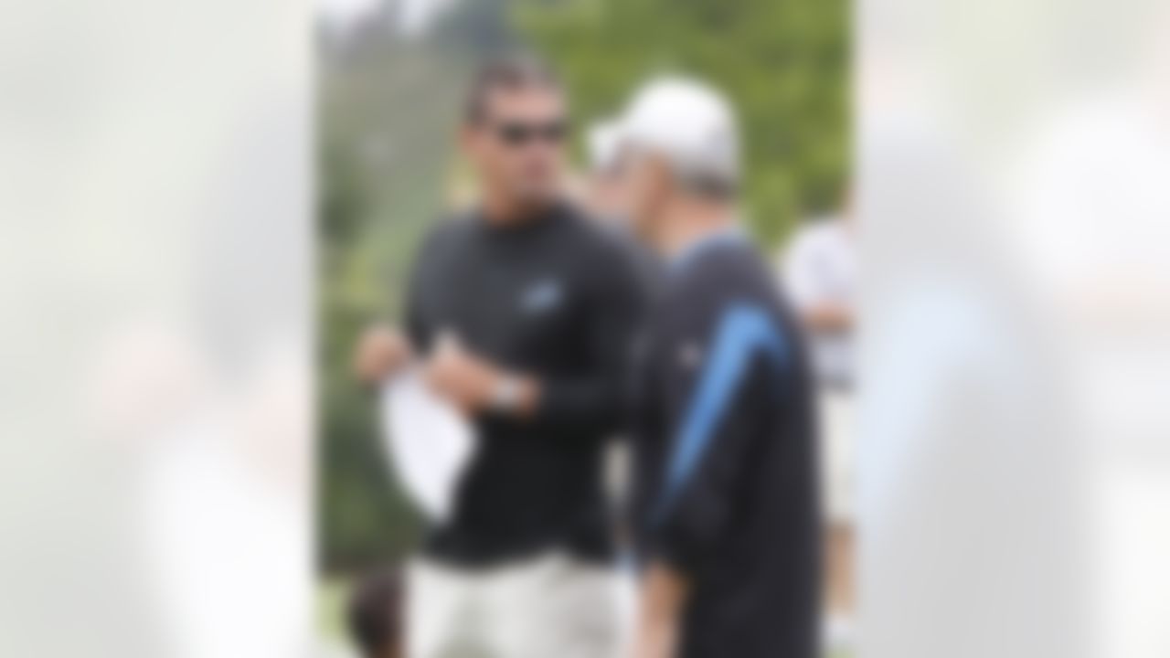 Detroit Lions head coach Jim Schwartz, left, talks with defensive coordinator Gunther Cunningham before the start of the team's NFL football training camp in Allen Park, Mich., Saturday, July 31, 2010. (AP Photo/Carlos Osorio)