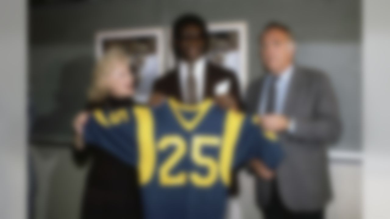 Eric Dickerson, Football Player, SMU running back L.A. Rams 1st round draft choice, with Rams owner, Georgia Frontiere and Coach John Robinson at news conference on April 26, 1983 in Anaheim, California. (AP Photo/Gary Ambrose)