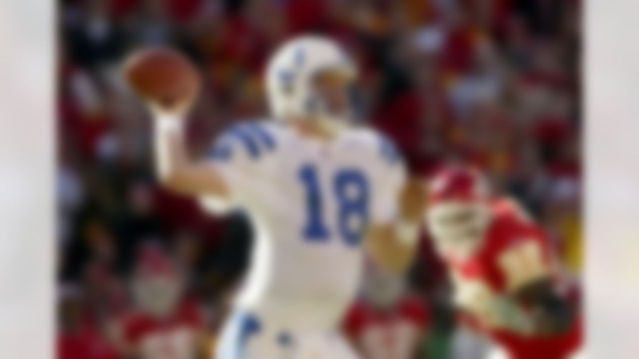 KANSAS CITY, MO - JANUARY 11: Quarterback Peyton Manning #18 of the Indianapolis Colts throws a pass against the the Kansas City Chiefs in the AFC Divisional Playoffs on January 11, 2004 at Arrowhead Stadium in Kansas City, Missouri. The Colts defeated the Chiefs 38-31 to advance to the AFC Championship Game against the New England Patriots. (Photo by Elsa/Getty Images)