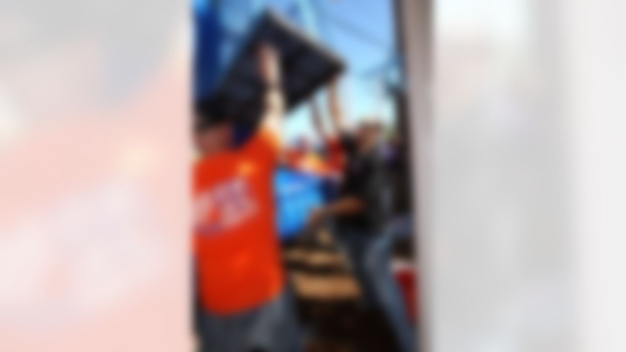 Mike Furrey and David Rock, Store Manager at The Home Depot, help put a piece of the new playground in place. (Photo by Tom Copeland/Home Depot)