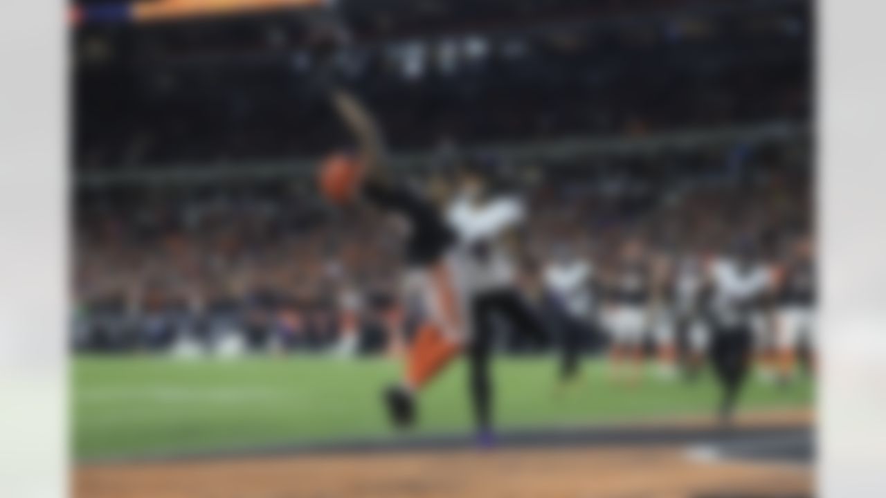 Cincinnati Bengals wide receiver Tee Higgins (85) reaches to make a catch during an NFL Super Wild Card Weekend playoff game against the Baltimore Ravens on Sunday, January 15, 2023 in Cincinnati, Ohio.
