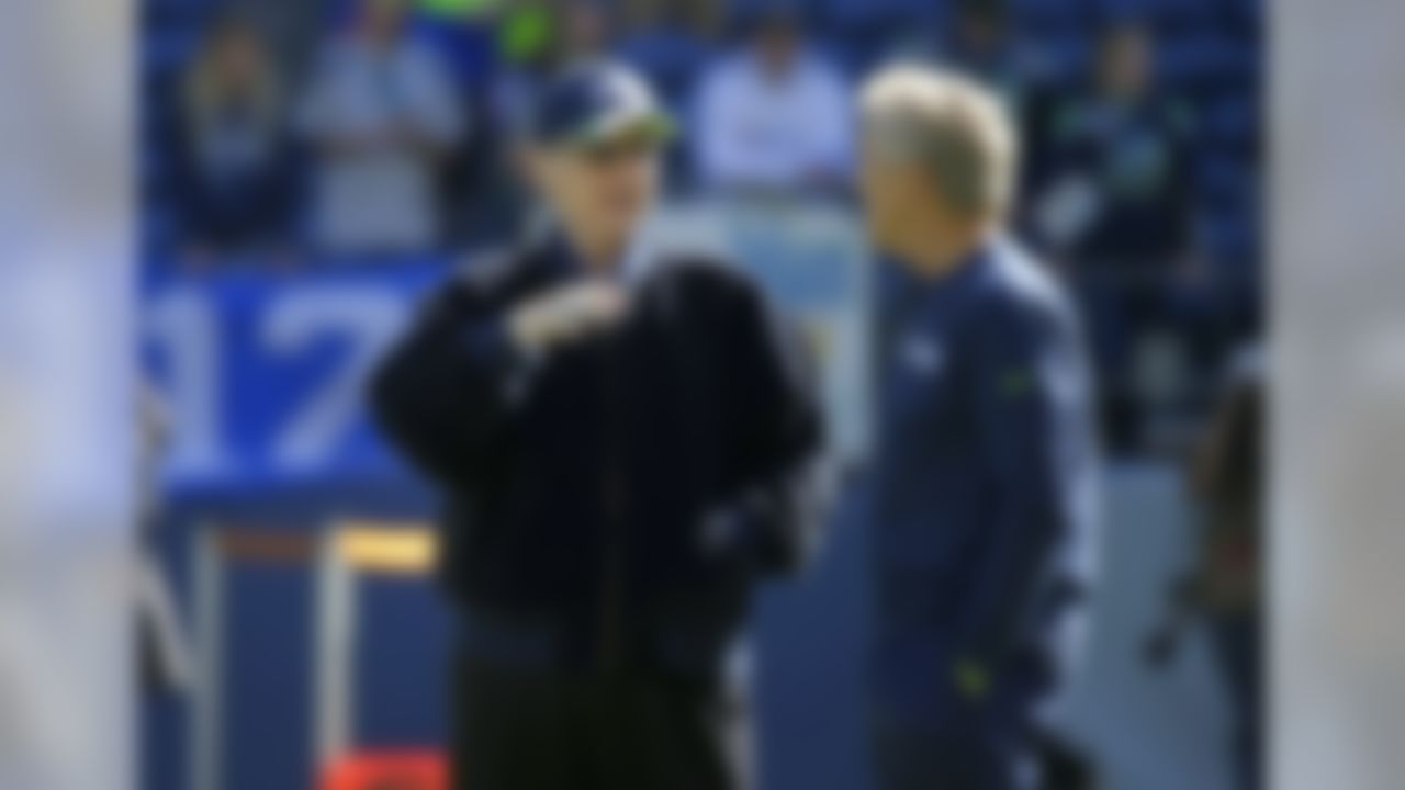 Seattle Seahawks owner Paul Allen, left, talks with Seahawks head coach Pete Carroll, right, before an NFL football game against the Chicago Bears, Sunday, Sept. 27, 2015, in Seattle. (AP Photo/Elaine Thompson)