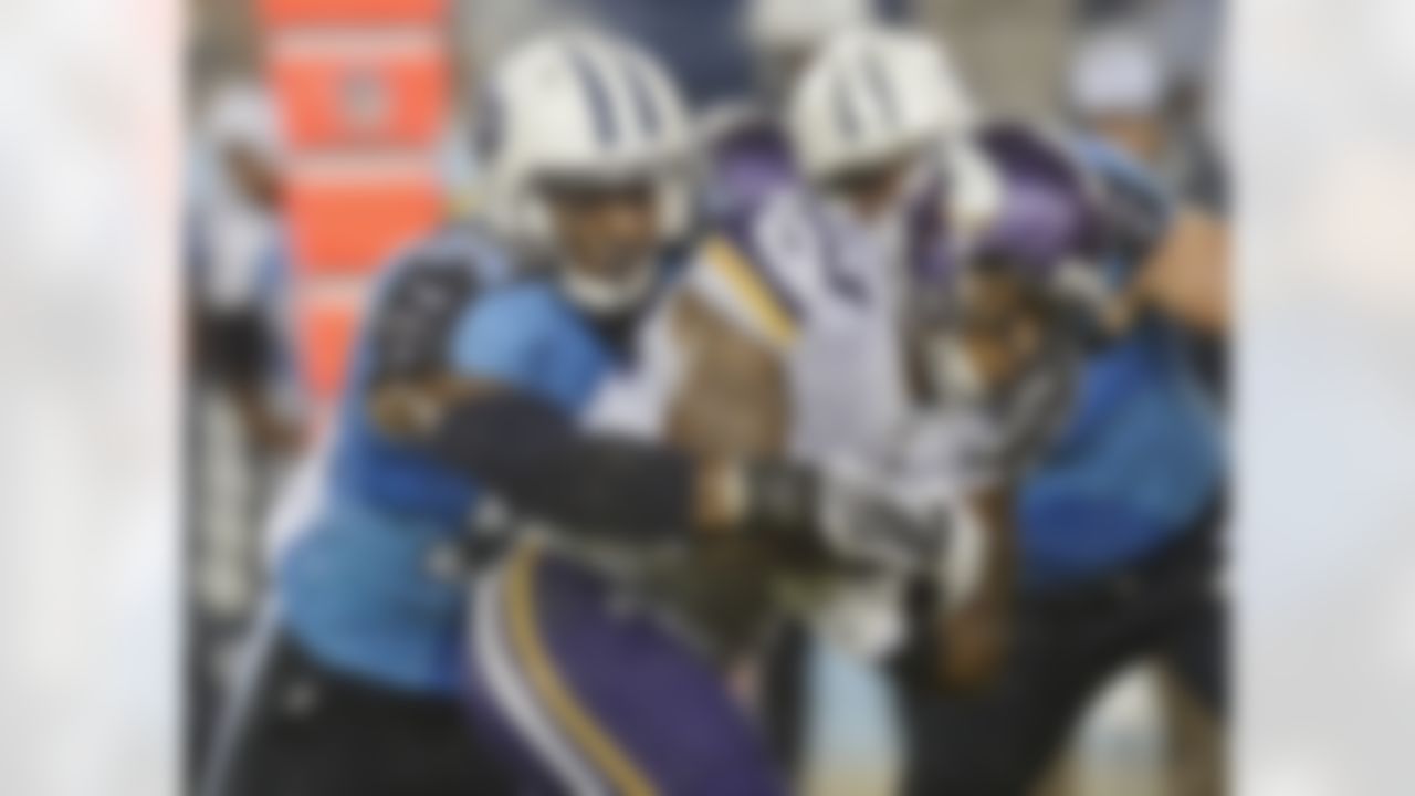 Minnesota Vikings running back Joe Banyard (23) is stopped by Tennessee Titans linebacker Avery Williamson (54) in the second quarter of a preseason NFL football game Thursday, Aug. 28, 2014, in Nashville, Tenn. (AP Photo/Mark Zaleski)