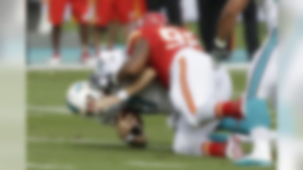 Kansas City Chiefs nose tackle Dontari Poe (92) sacks Miami Dolphins quarterback Ryan Tannehill (17) during the first half of an NFL football game, Sunday, Sept. 21, 2014, in Miami Gardens, Fla. (AP Photo/Wilfredo Lee)