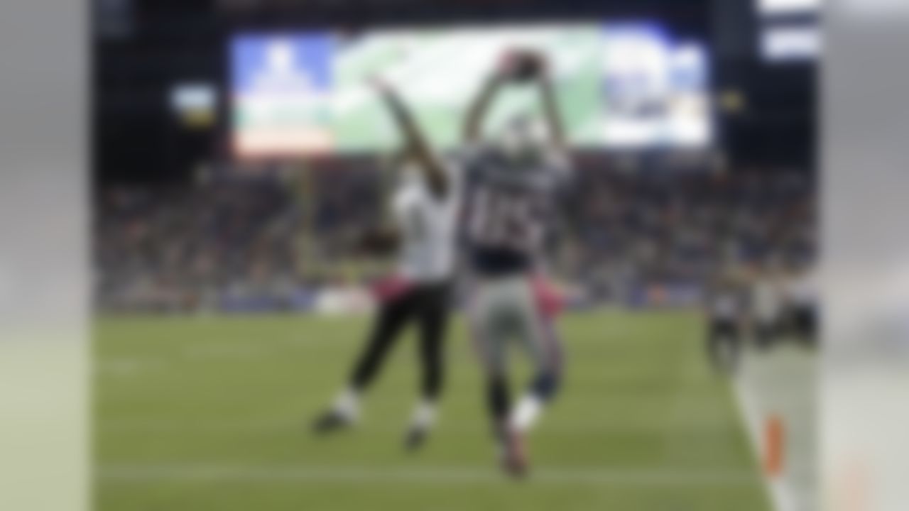 New England Patriots wide receiver Kenbrell Thompkins (85) catches the winning touchdown pass against New Orleans Saints cornerback Jabari Greer (33) in the fourth quarter of an NFL football game Sunday, Oct.13, 2013, in Foxborough, Mass. The Patriots won 30-27. (AP Photo/Stephan Savoia)