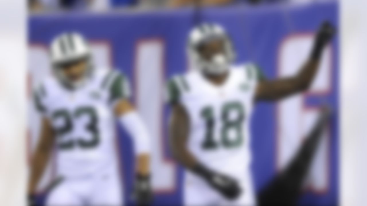New York Jets wide receiver Walt Powell (18) celebrates after returning a punt for a touchdown as teammate Dexter McDougle (23) looks on during the second half of a preseason NFL football game against the New York Giants, Saturday, Aug. 29, 2015, in East Rutherford, N.J. (AP Photo/Bill Kostroun)