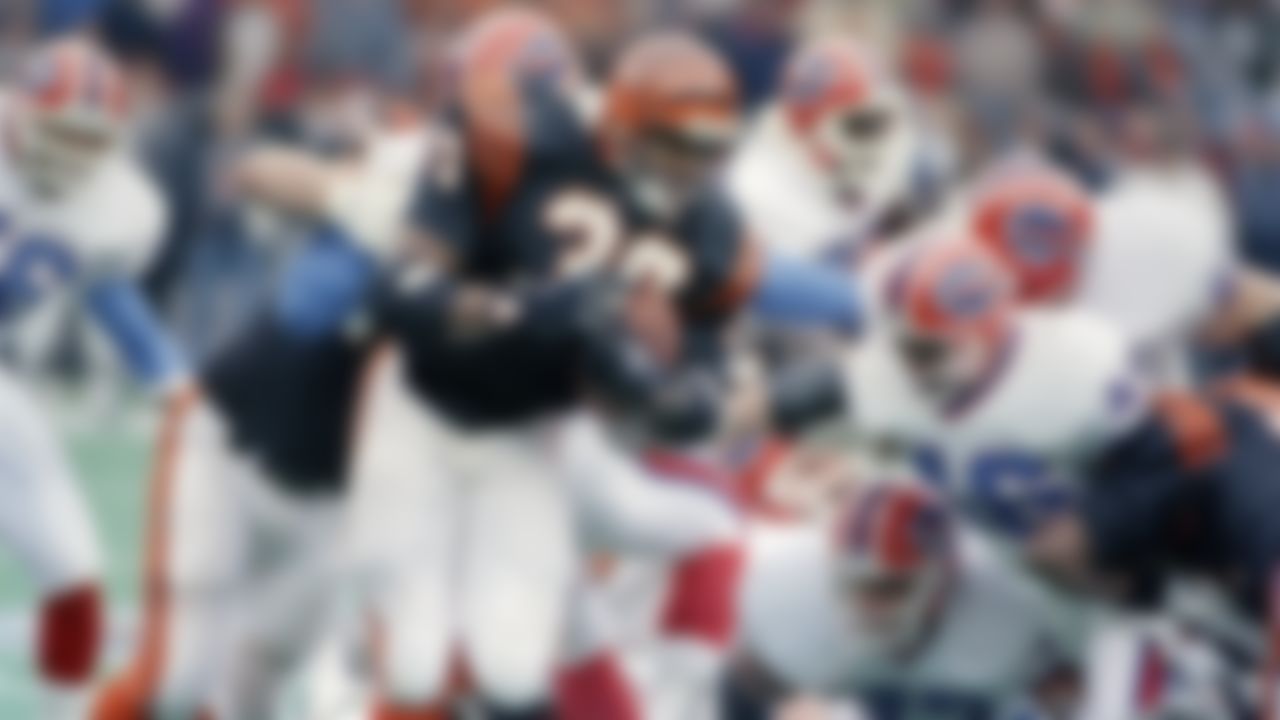 Ickey Woods (30) of the Cincinnati Bengals evades Buffalo Bills defenders in the Super Bowl in Miami.