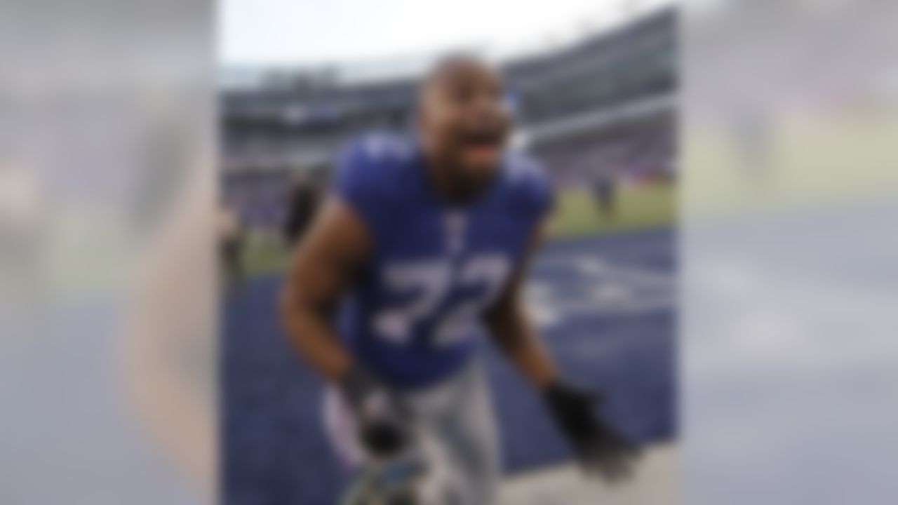 New York Giants defensive end Osi Umenyiora celebrates after an NFL wild card playoff football game against the Atlanta Falcons Sunday, Jan. 8, 2012, in East Rutherford, N.J. The Giants defeated the Falcons 24-2.  (AP Photo/Matt Slocum)