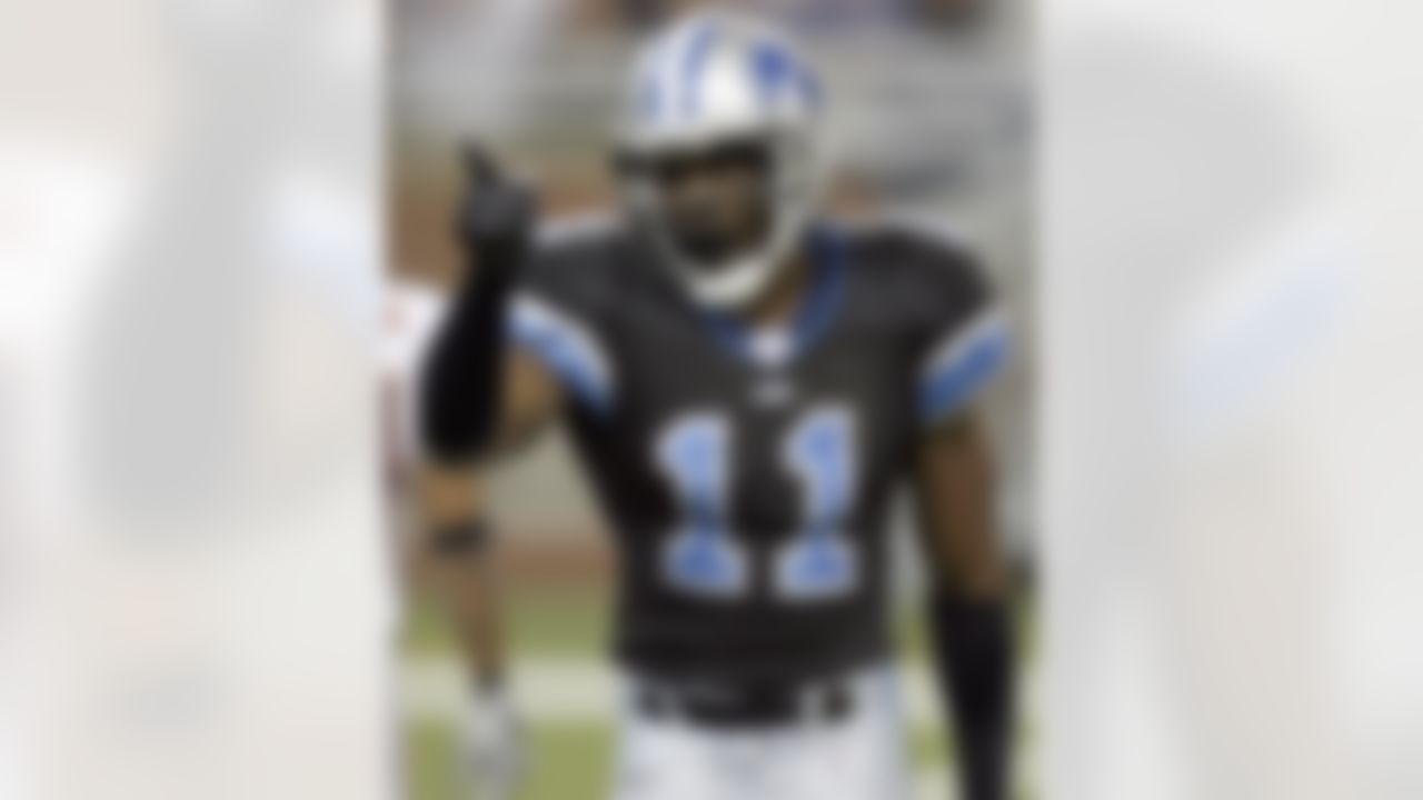 DETROIT - DECEMBER 24: Roy Williams #11 of the Detroit Lions points on the field during a game against the Chicago Bears on December 24, 2006 at Ford Field in Detroit, Michigan. Chicago won the game 26-21. Photo by Getty Images.
