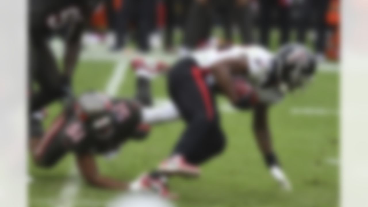 Atlanta Falcons running back Brian Hill (23) eludes Tampa Bay Buccaneers linebacker Kevin Minter (51) during the second half of an NFL football game Sunday, Jan. 3, 2021, in Tampa, Fla.