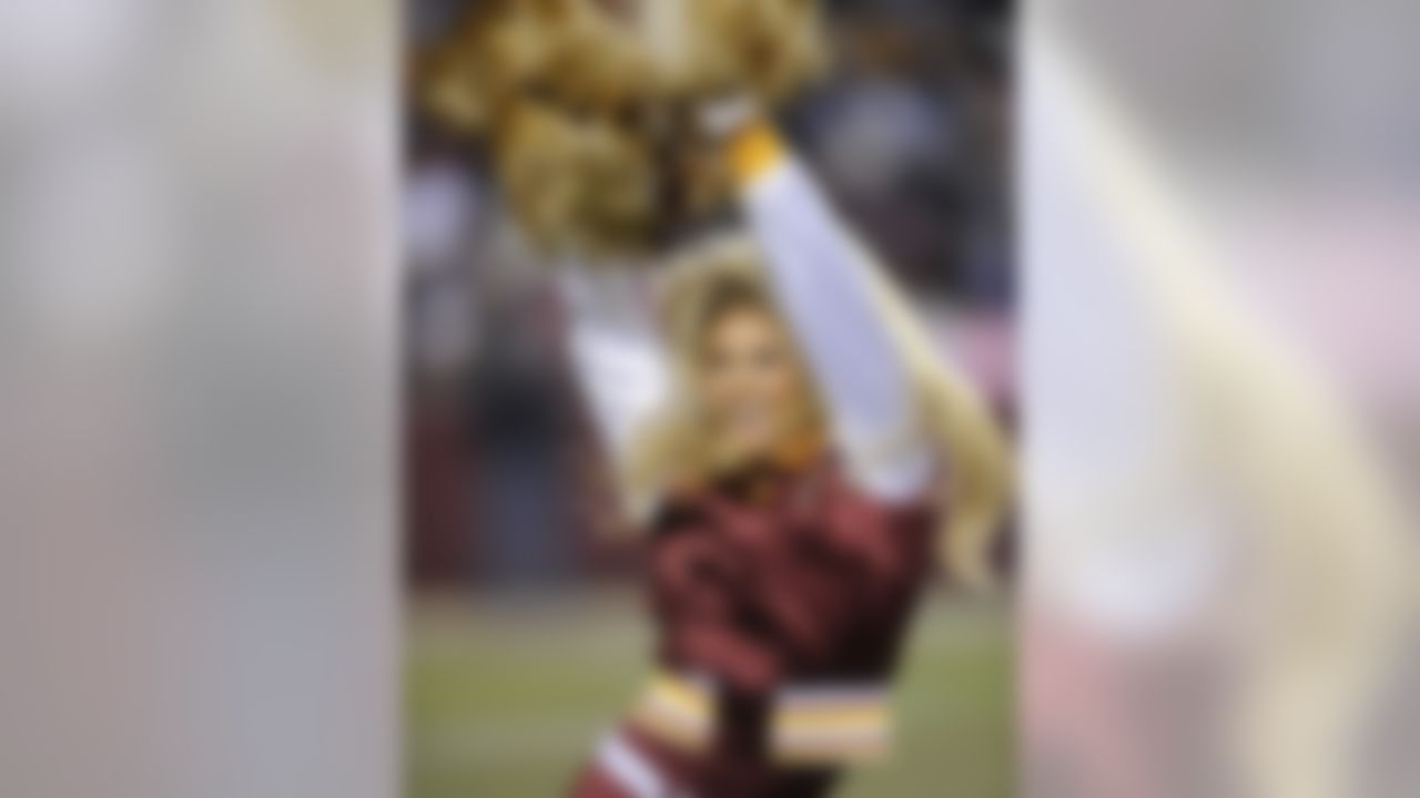 A Washington Redskins cheerleader performs during the NFL football game against the Dallas Cowboys, Sunday, Dec. 27, 2009 in Landover, Md. (AP Photo/Nick Wass)