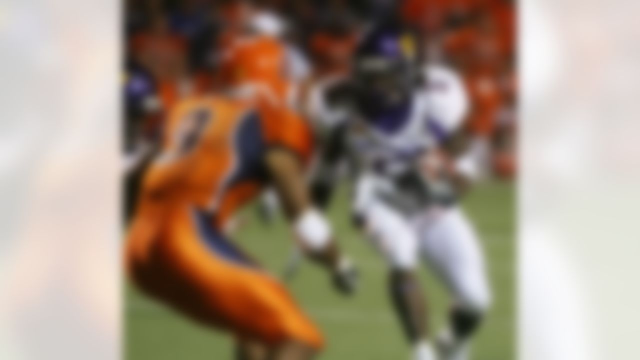East Carolina running back Chris Johnson, right, tries to elude UTEP defender Quintin Demps during the first quarter Saturday Oct. 13, 2007 in El Paso, Texas. (AP Photo/ Victor Calzada)