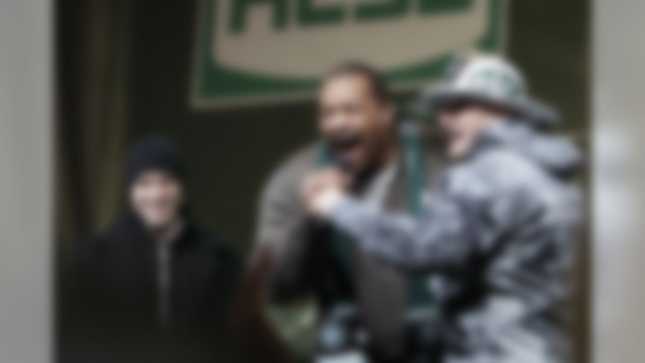 New York Jets defensive tackle Kris Jenkins, center, safety Jim Leonhard, left, and Ed Anzalone, right, talk to fans during a rally in Times Square, Thursday, Jan. 20, 2011, in New York. The Jets will play the Pittsburgh Steelers for the AFC Championship, Sunday, Jan. 23, in Pittsburgh. (AP Photo/Frank Franklin II)