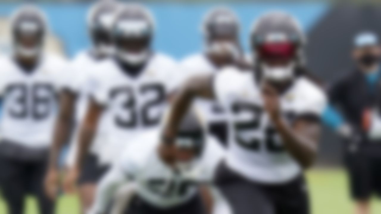 Jacksonville Jaguars cornerback Shaquill Griffin, front, runs sprints with teammates during an NFL football practice, Monday, June 14, 2021, in Jacksonville, Fla.