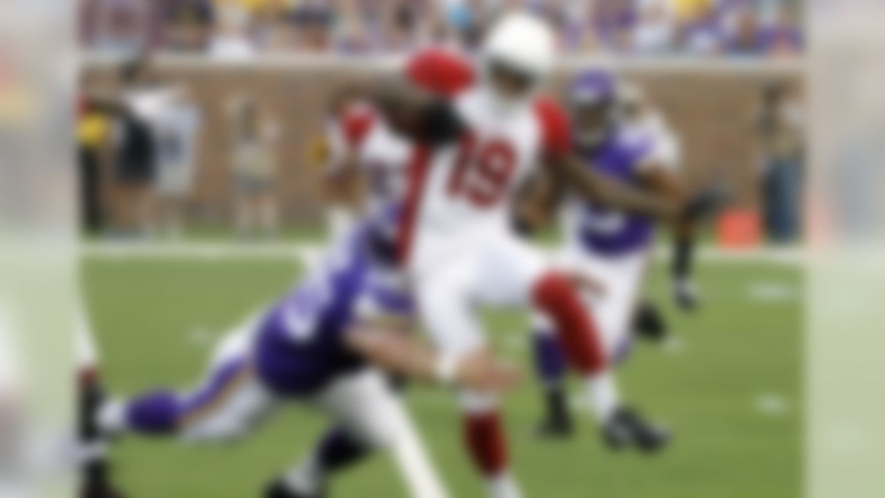 Arizona Cardinals wide receiver Ted Ginn (19) tries to break a tackle by Minnesota Vikings' Rhett Ellison during the first half of an NFL preseason football game, Saturday, Aug. 16, 2014, in Minneapolis. (AP Photo/Ann Heisenfelt)