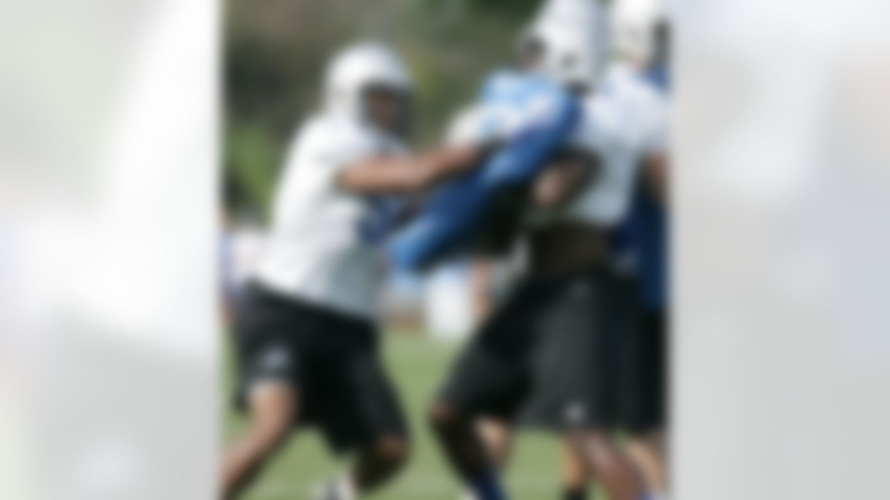 Detroit Lions linebacker Doug Hogue, left, goes up against teammate Tahir Whitehead during NFL football training camp, Thursday, Aug 2, 2012, in Allen Park, Mich. (AP Photo/Duane Burleson)