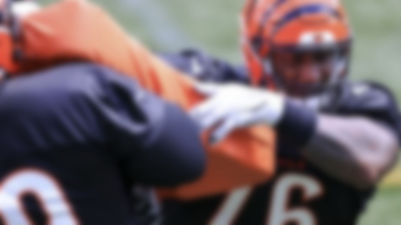 Cincinnati Bengals' Tyler Shelvin, left, runs a drill with Mike Daniels, right, during an NFL football minicamp practice in Cincinnati, Tuesday, June 15, 2021.