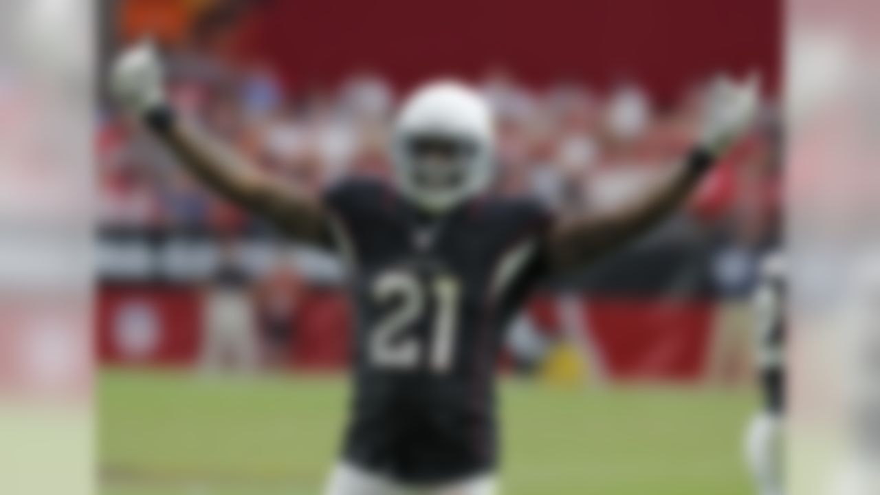 Arizona Cardinals cornerback Patrick Peterson (21) pumps up the crowd during the second half of an NFL football game against the San Francisco 49ers, Sunday, Sept. 21, 2014, in Glendale, Ariz. (AP Photo/Rick Scuteri)