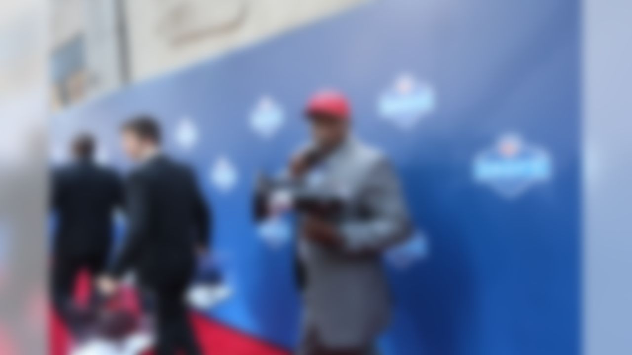 NFL Network's Warren Sapp walks on the red carpet with a megaphone at the 2013 NFL Draft on April 25, 2013 at Radio City Music Hall in New York, NY. (Ben Liebenberg/NFL)
