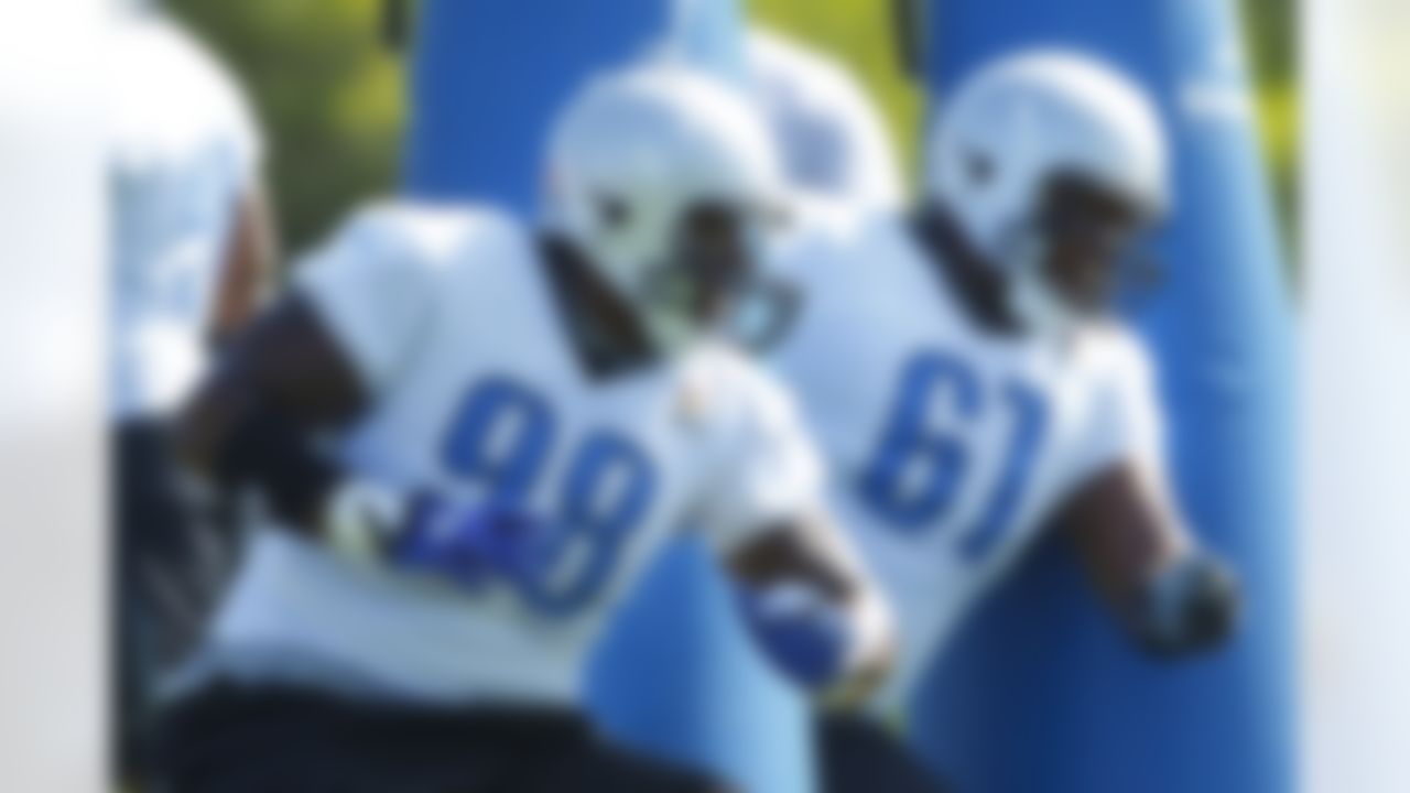 Detroit Lions defensive tackle Nick Fairley (98) and defenses tackle Sammie Hill (61) runs drills during NFL football training camp at the team's practice facility in Allen Park, Mich., Saturday, July 30, 2011. (AP Photo/Rick Osentoski)