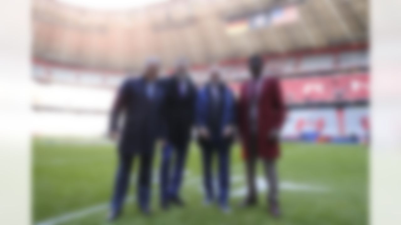 NFL Network hosts Steve Mariucci, Kurt Warner, Rich Eisen, and Michael Irvin pose for a photo prior to an NFL football game between the Seattle Seahawks and the Tampa Bay Buccaneers on Sunday, Nov. 13, 2022 in Munich, Germany.