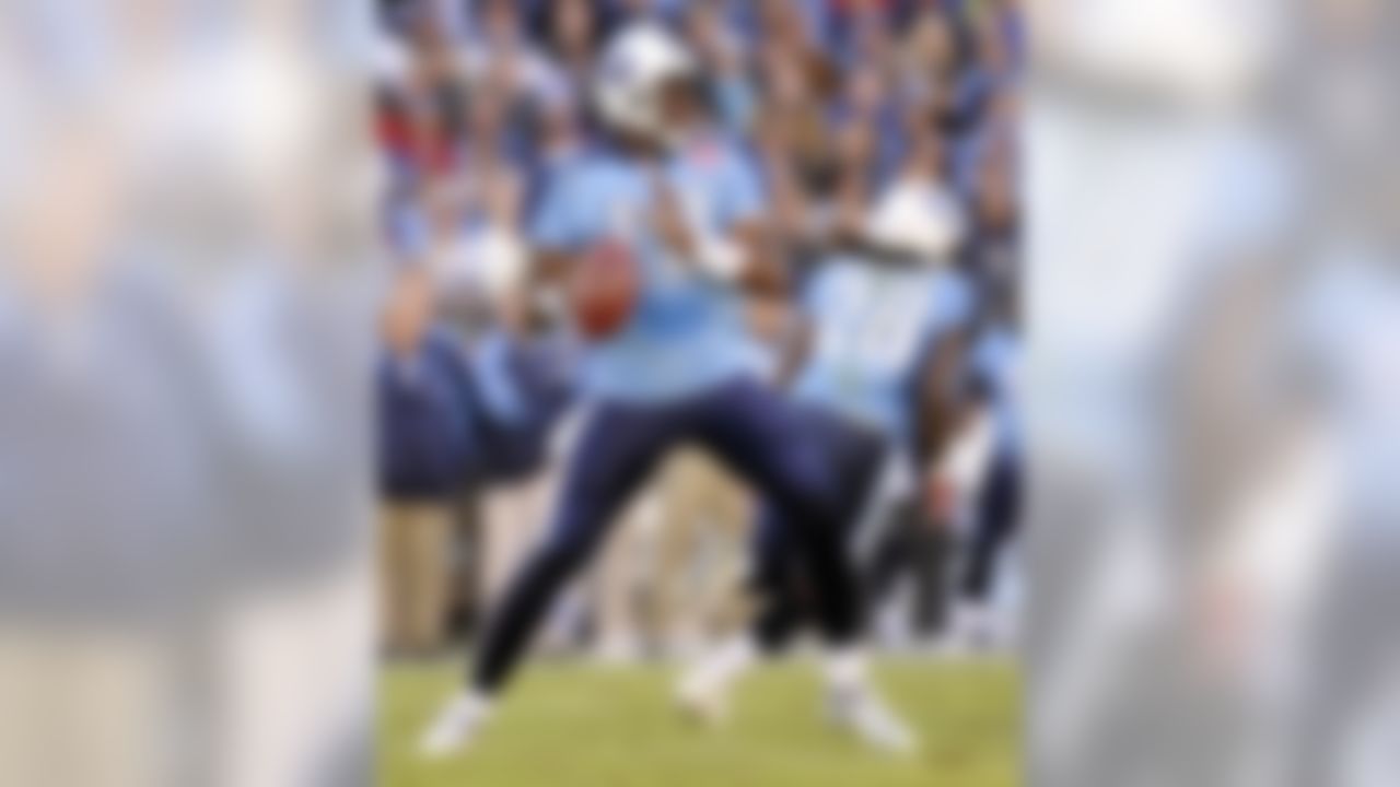 Tennessee Titans quarterback Vince Young (10) looks for a receiver as he plays against the Jacksonville Jaguars in the first quarter of an NFL football game in Nashville, Tenn., Sunday, Nov. 1, 2009. (AP Photo/John Russell)