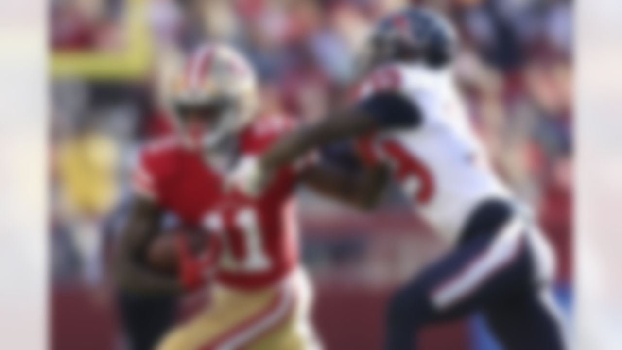 San Francisco 49ers wide receiver Brandon Aiyuk (11) runs against Houston Texans cornerback Terrance Mitchell during the first half of an NFL football game in Santa Clara, Calif., Sunday, Jan. 2, 2022.