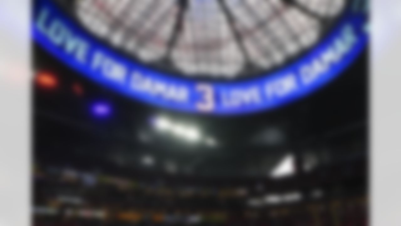 "Love for Damar 3" is displayed in honor of an injured Buffalo Bills player Damar Hamlin inside the Mercedes-Benz Stadium before an NFL football game, Sunday, Jan. 8, 2023, in Atlanta.