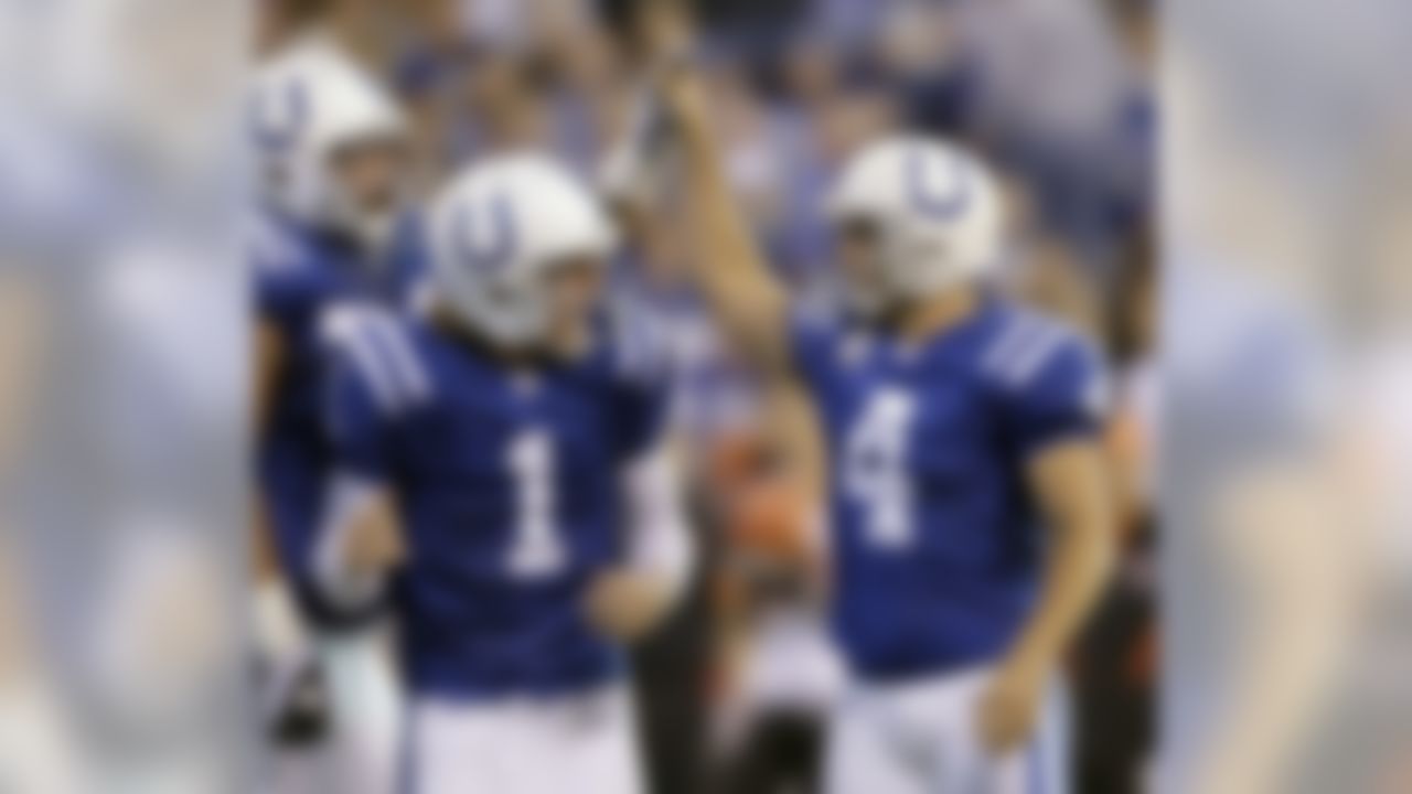 Indianapolis Colts placekicker Adam Vinatieri, right, celebrates with holder Pat McAfee (1) and Charlie Johnson in the first quarter of an NFL football game against the Cincinnati Bengals in Indianapolis, Sunday, Nov. 14, 2010. (AP Photo/Michael Conroy)