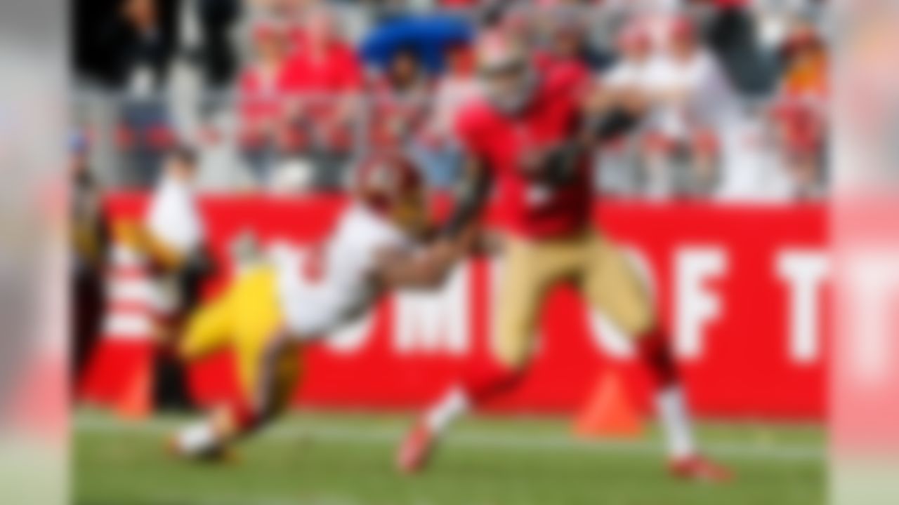 Washington Redskins inside linebacker Perry Riley (56) tackles San Francisco 49ers quarterback Colin Kaepernick (7) during the NFL regular season game on Sunday, Nov. 23, 2014 at the Levi's Stadium in Santa Clara, Calif. (Ric Tapia/NFL)