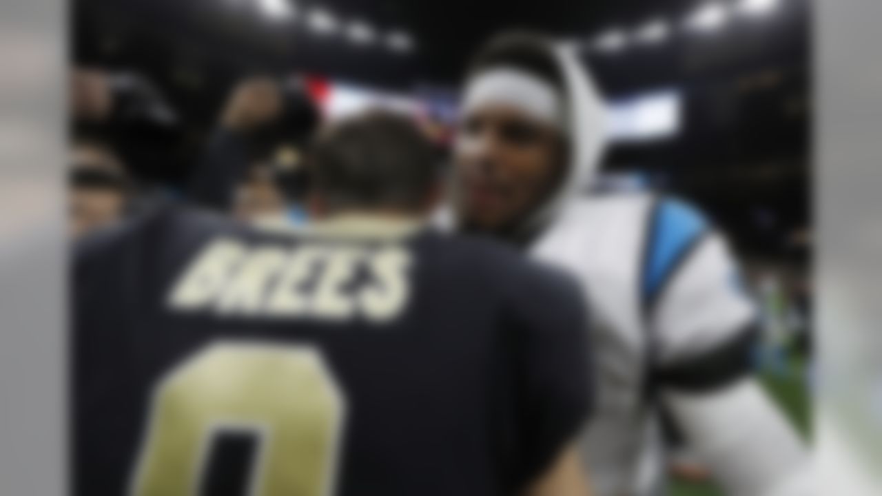 New Orleans Saints quarterback Drew Brees (9) and Carolina Panthers quarterback Cam Newton (1) shake hands following an NFL football wild card playoff game on Sunday, Jan. 7, 2018 in New Orleans.