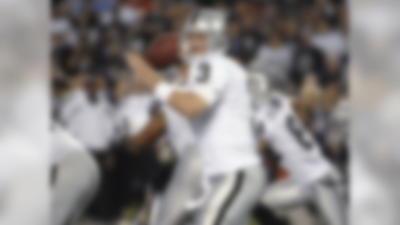 Oakland Raiders quarterback Carson Palmer (3) sets to throw a pass in the second quarter against the San Diego Chargers in an NFL football game Thursday, Nov. 10, 2011, in San Diego. (AP Photo/Denis Poroy)