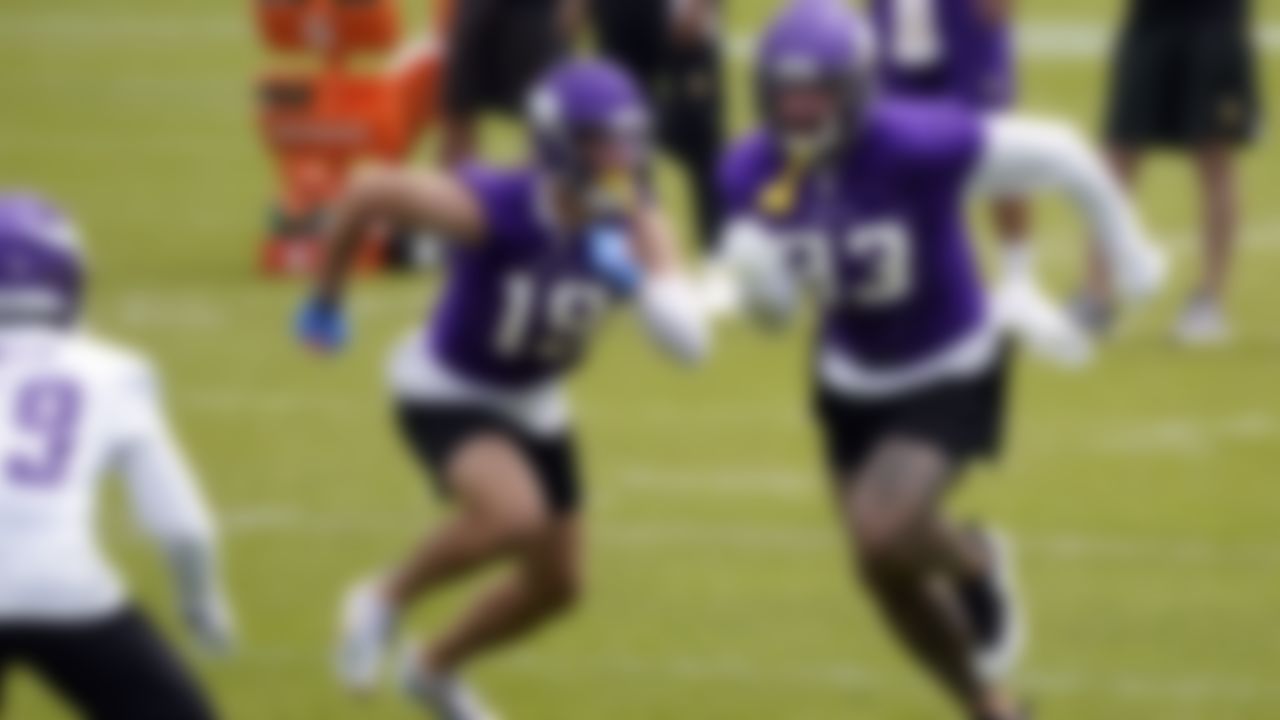 Minnesota Vikings wide receiver Adam Thielen, left, and tight end Tyler Conklin run a pass route during a drill at NFL football practice in Eagan, Minn., Wednesday, June 2, 2021.