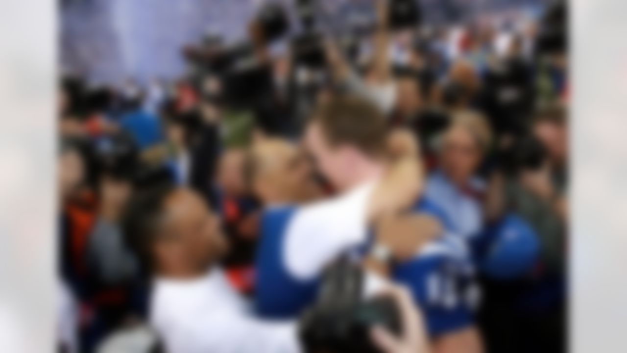 INDIANAPOLIS - JANUARY 21: Head coach Tony Dungy of the Indianapolis Colts celebrates with quarterback Peyton Manning #18 after their team defeated the New England Patriots 38-34 in the AFC Championship Game on January 21, 2007 at the RCA Dome in Indianapolis, Indiana. (Photo by Doug Benc/Getty Images)