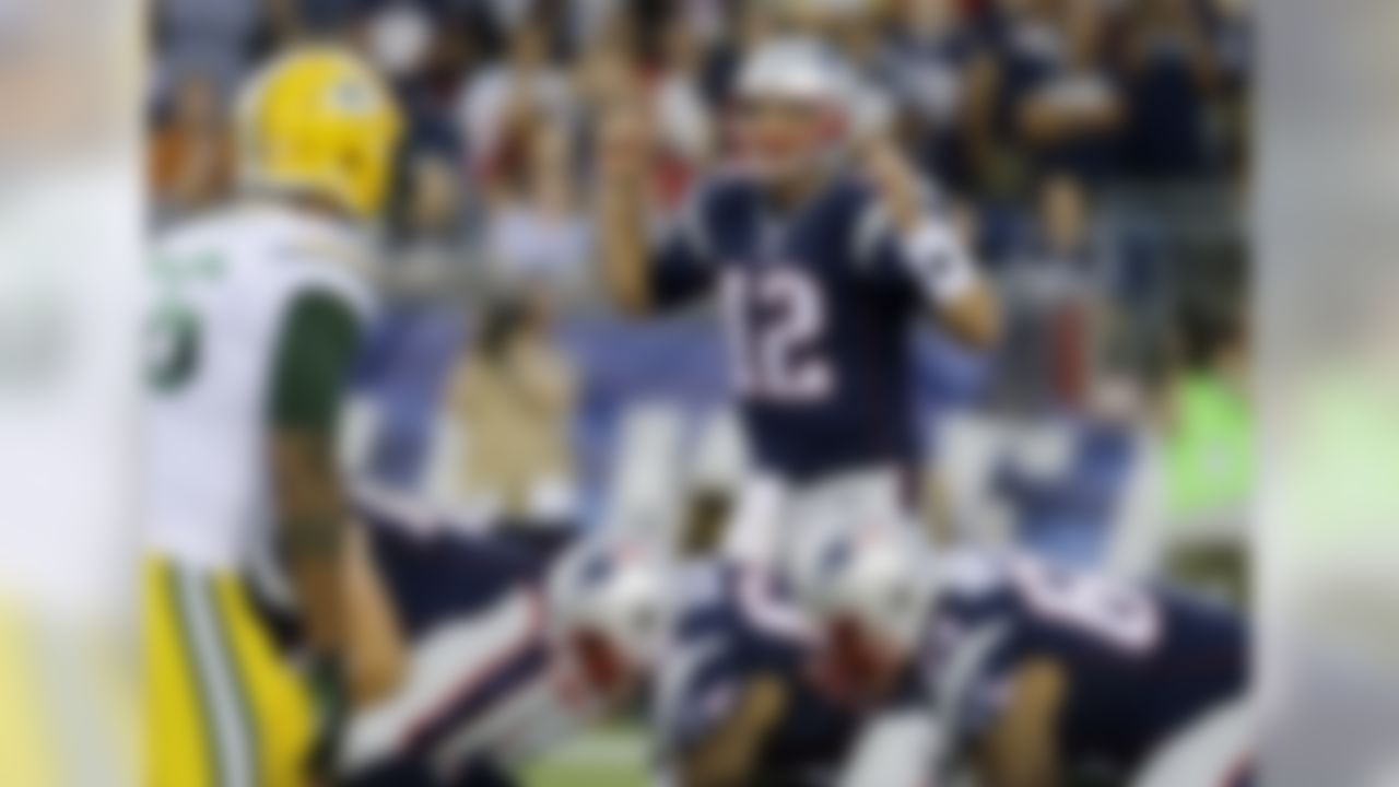 New England Patriots quarterback Tom Brady  sets his team at the line of scrimmage against the Green Bay Packers in the first half of an NFL preseason football game Thursday, Aug. 13, 2015, in Foxborough, Mass. (AP Photo/Charles Krupa)