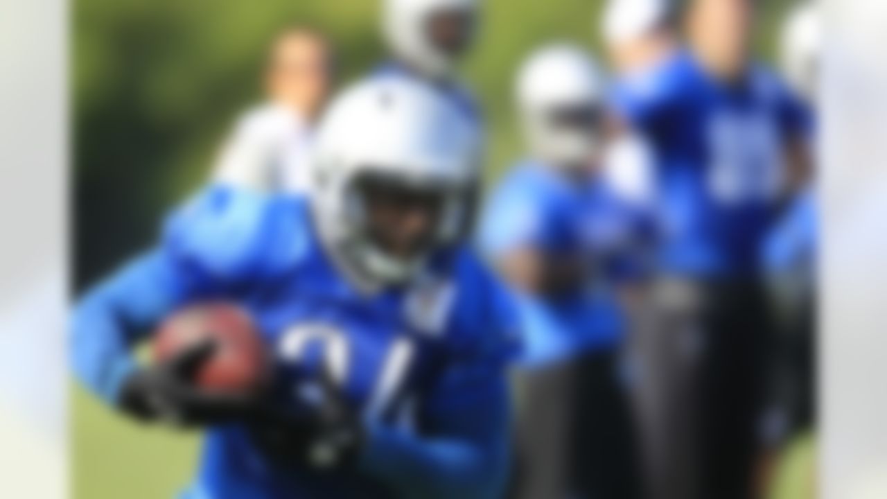 Detroit Lions running back Erik Coleman runs drills during NFL football training camp in Allen Park, Mich. Monday, July 30, 2012. (AP Photo/Carlos Osorio)