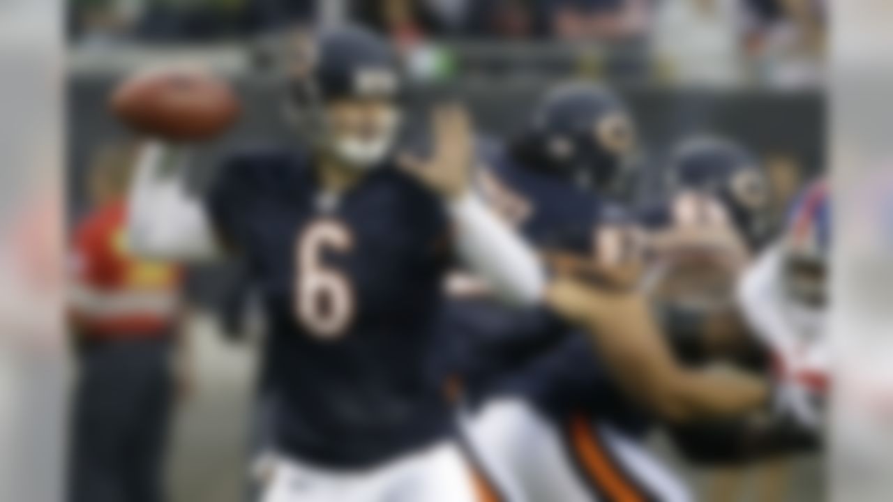 Chicago Bears quarterback Jay Cutler passes under pressure from New York Giants defensive tackle Barry Cofield during the first quarter of an NFL preseason football game Saturday, Aug. 22, 2009 in Chicago. (AP Photo/Charles Rex Arbogast)