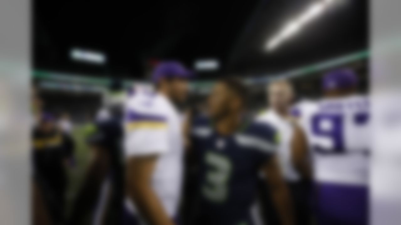 Minnesota Vikings quarterback Sam Bradford and Seattle Seahawks quarterback Russell Wilson pose for a photo during an NFL preseason game on Thursday, Aug. 18, 2017 in Seattle. (Ric Tapia/NFL)