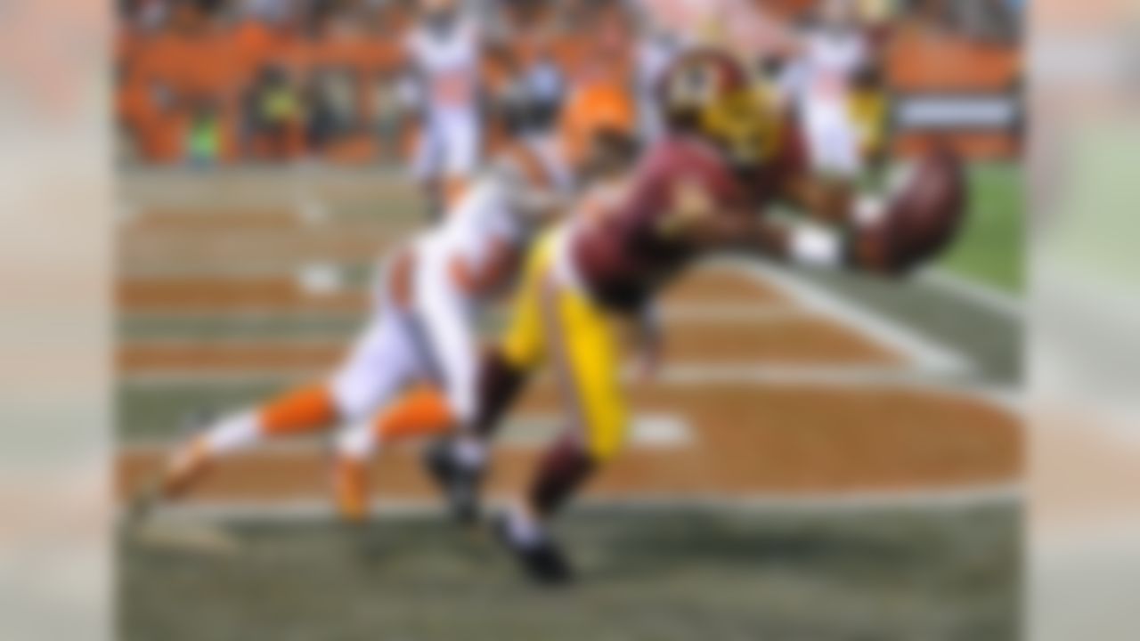 Washington Redskins wide receiver Rashad Ross (19) can't catch a pass under pressure form Cleveland Browns cornerback Kendall James (37) during the third quarter of an NFL preseason football game, Thursday, Aug. 13, 2015, in Cleveland. (AP Photo/David Richard)