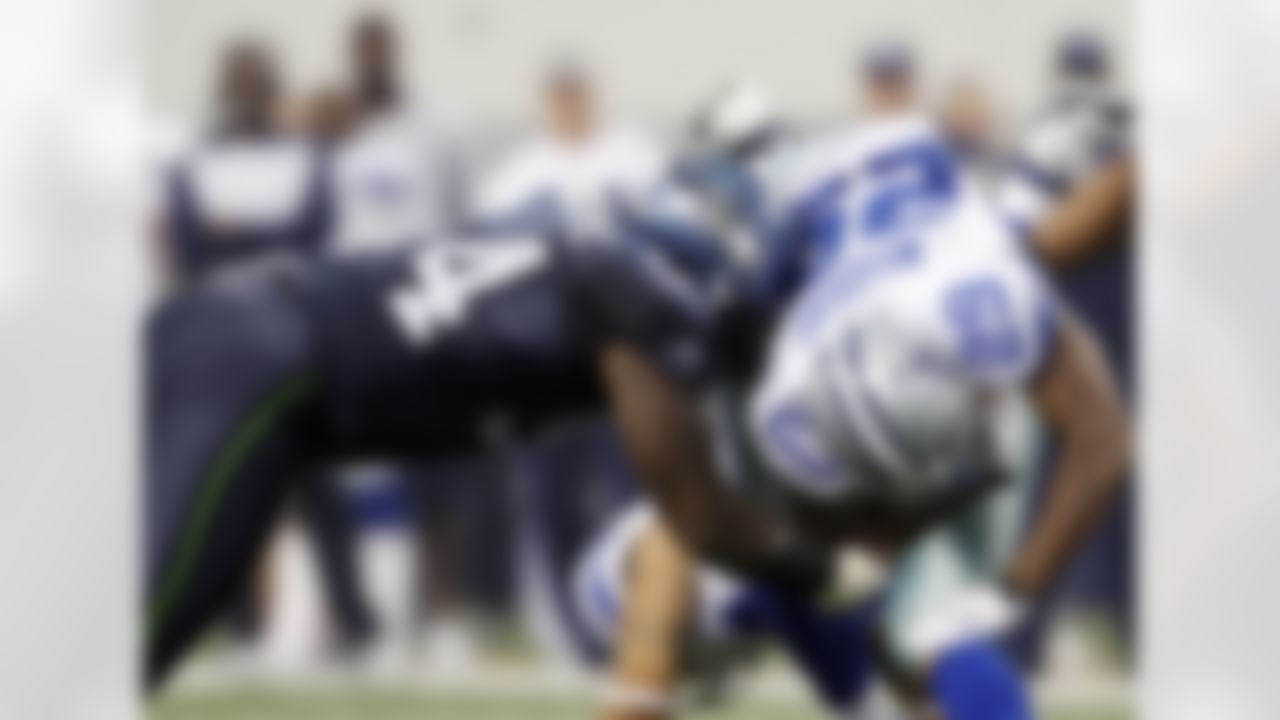 Seattle Seahawks' Anthony Hargrove, left, tackles Dallas Cowboys' DeMarco Murray during the second half of an NFL football game on Sunday, Nov. 6, 2011, in Arlington, Texas. (AP Photo/Jim Cowsert)