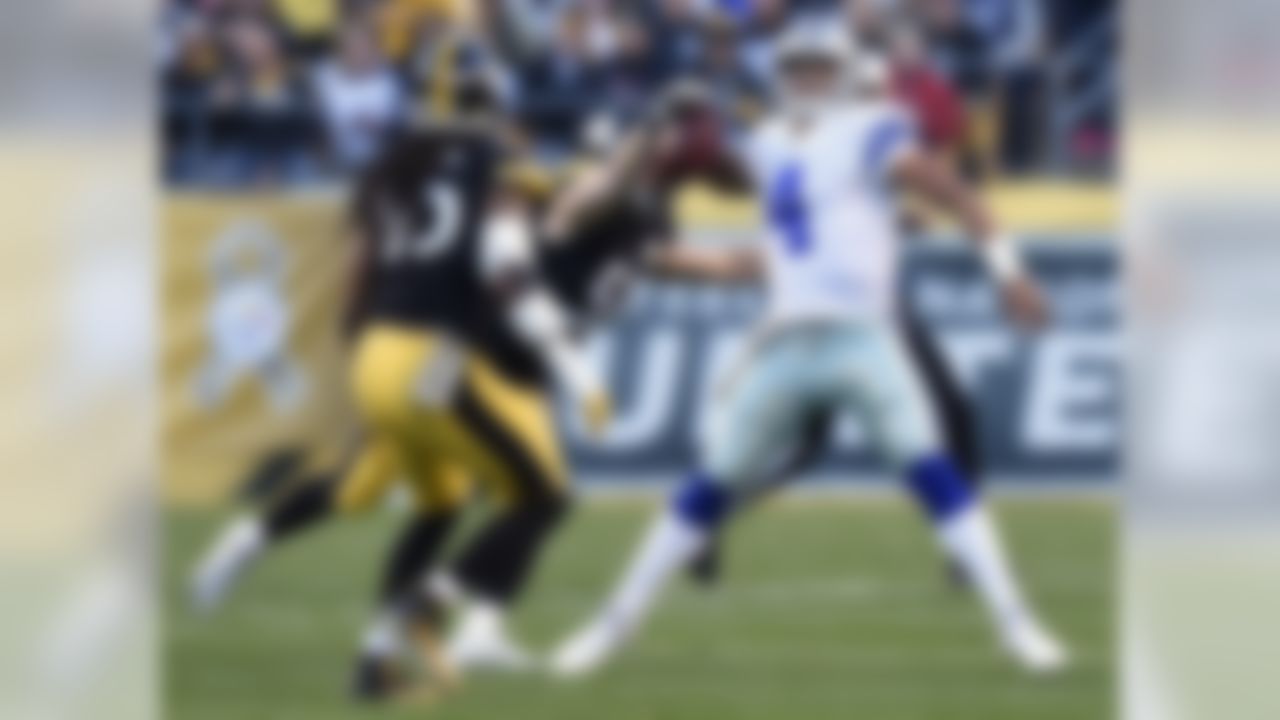 Pittsburgh Steelers outside linebacker Anthony Chickillo (56) forces a fumble by Dallas Cowboys quarterback Dak Prescott (4) during the first half of an NFL football game in Pittsburgh, Sunday, Nov. 13, 2016. The Steelers recovered the fumble. (AP Photo/Don Wright)