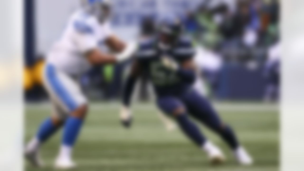 Seattle Seahawks defensive end Darrell Taylor (52) rushes the edge during an NFL football game against the Detroit Lions on Sunday, January 2, 2022 in Seattle, Washington.