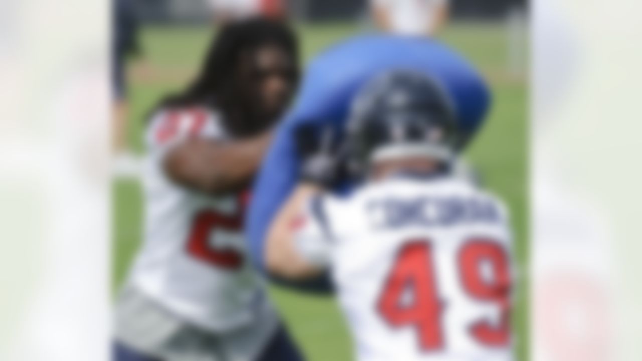 Houston Texans' running back Chris Henry (27) runs drills with rookie Jack Corcoran (49) during an NFL football mini camp Tuesday, May 18, 2010, in Houston. (AP Photo/Dave Einsel)