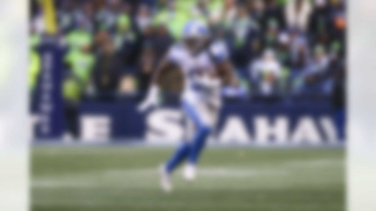Detroit Lions running back Jamaal Williams (30) runs with the ball during an NFL football game against the Seattle Seahawks on Sunday, January 2, 2022 in Seattle, Washington.