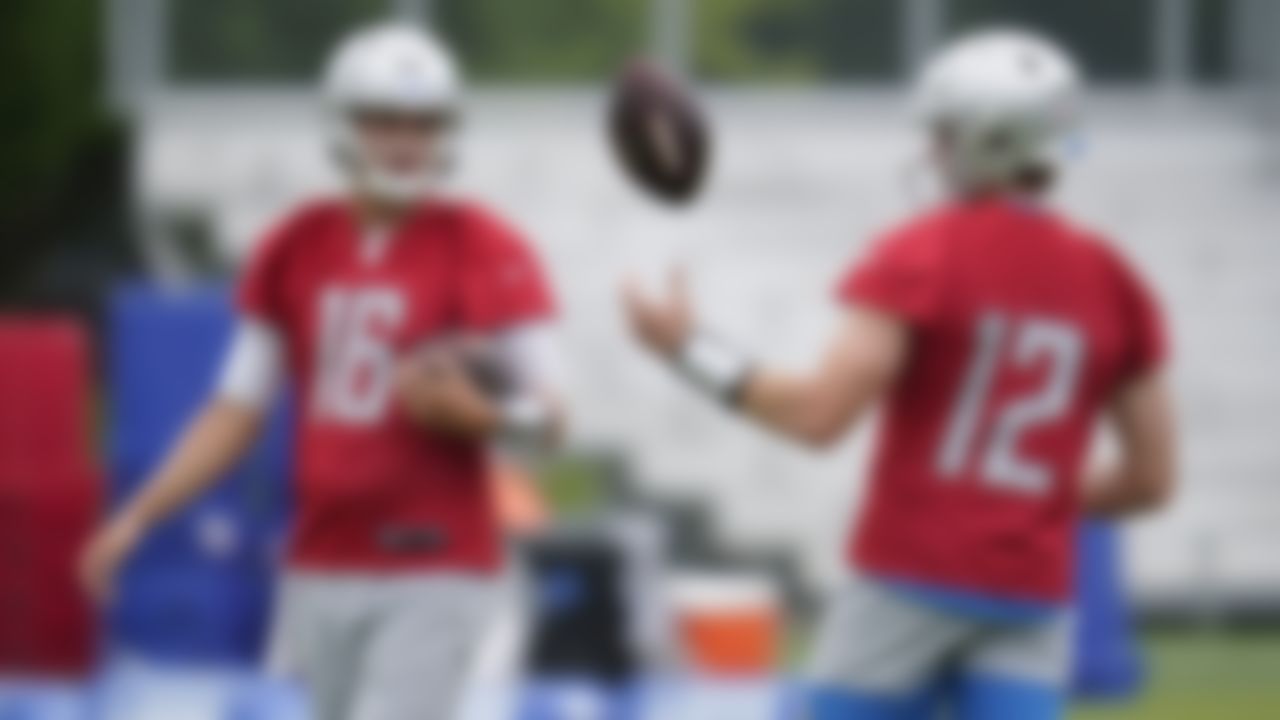 Detroit Lions quarterback Jared Goff, left, talks with Tim Boyle, right, during an NFL football practice in Allen Park, Mich., Thursday, June 10, 2021.