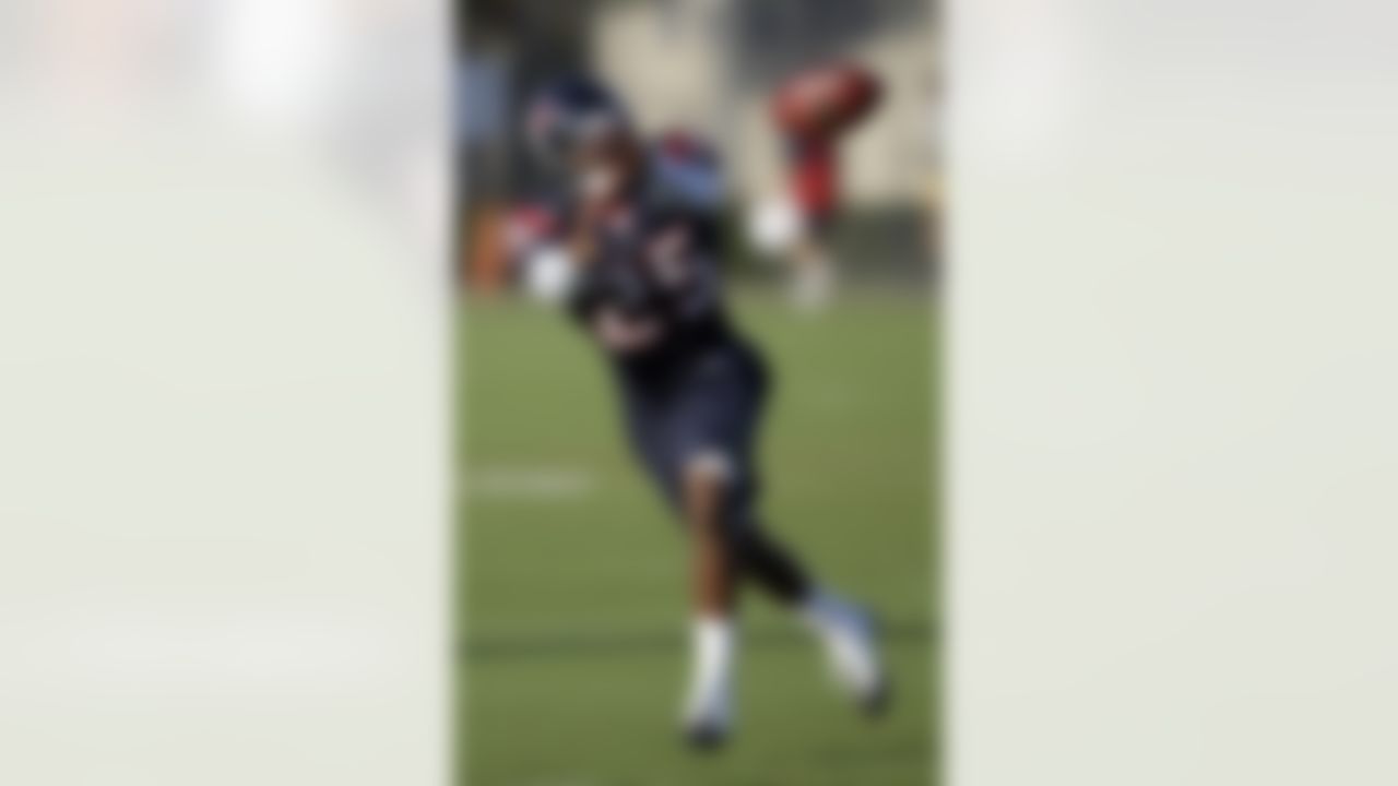 Houston Texans cornerback Kareem Jackson reaches to catch the ball during an NFL football training camp practice Sunday, Aug. 1, 2010, in Houston. (AP Photo/David J. Phillip)