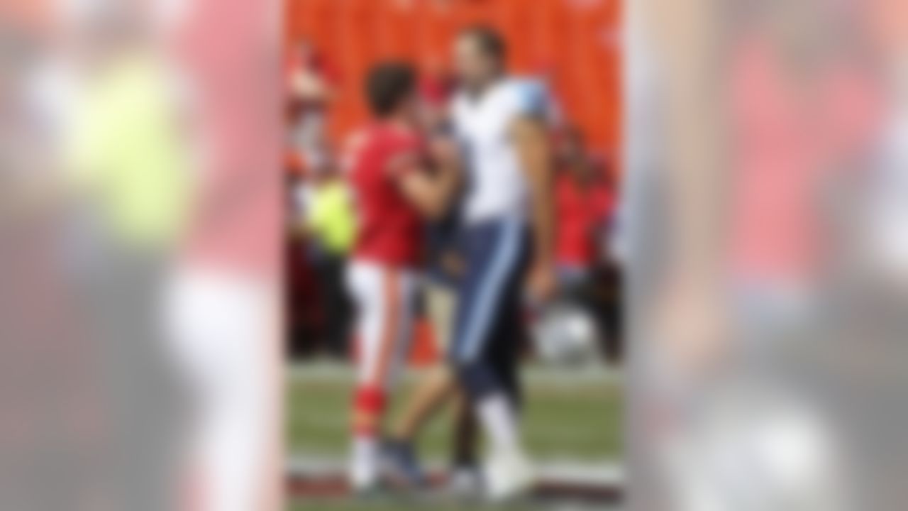 Kansas City Chiefs kicker Cairo Santos (5), of Brazil,  talks to Tennessee Titans kicker Ryan Succop (8), who used to kick for the Chiefs, before an NFL football game in Kansas City, Mo., Sunday, Sept. 7, 2014. (AP Photo/Ed Zurga)