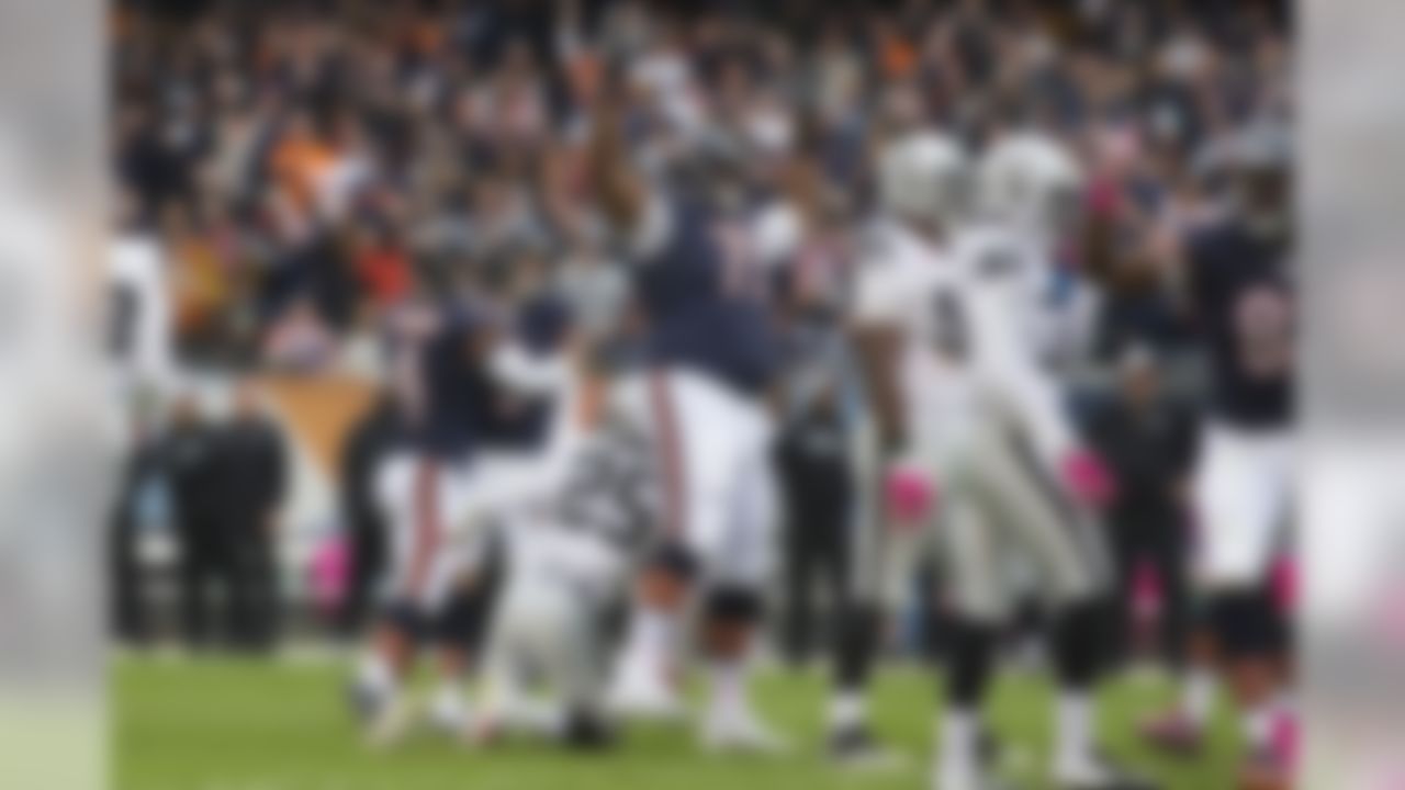 Chicago Bears kicker Robbie Gould (9) is congratulated by holder Spencer Lanning following Gould's 49 yard game winning field goal over the Oakland Raiders  on Sunday, Oct. 4, 2015 in Chicago, Il. The Bears beat the Raiders 22-20. (Todd Rosenberg/NFL)